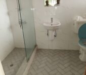 Three bedroom house with an outhouse to let at North Ridge, Accra